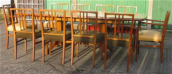 Gordon Russell, extending teak dining table with ten chairs including two carvers W.230cm